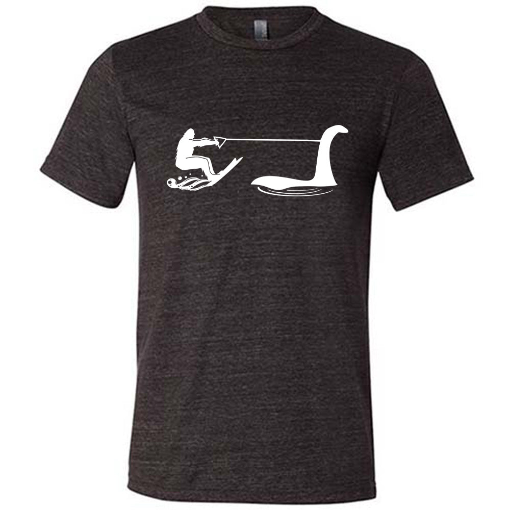 Black colored shirt with bigfoot wakeboarding with Nessie graphic on it