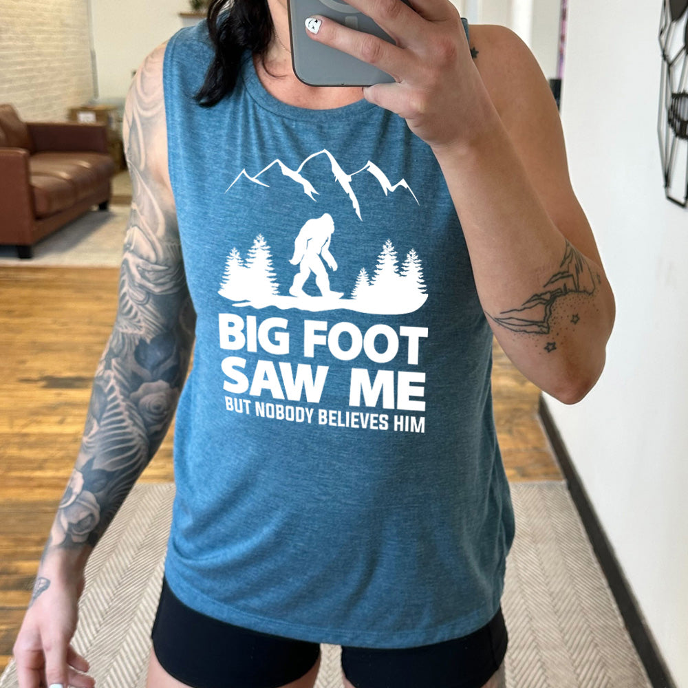 deep teal muscle tank with bigfoot in the woods graphic on it that says "Bigfoot Saw Me But Nobody Believes Him"