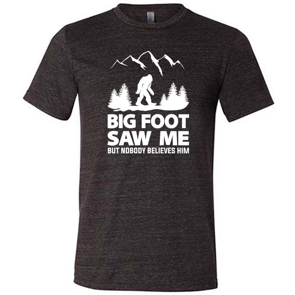 Black colored shirt with bigfoot in the woods graphic on it that says "Bigfoot Saw Me But Nobody Believes Him"