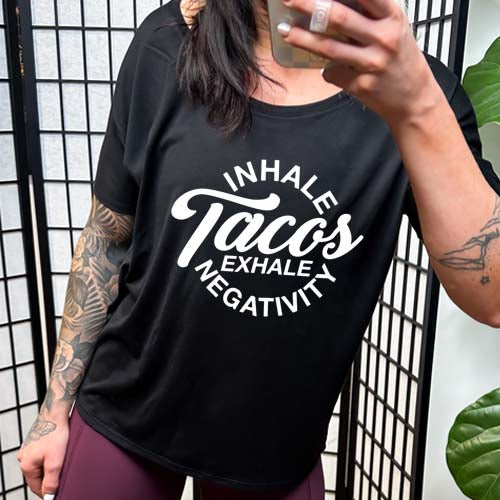 model wearing the "Inhale Tacos Exhale Negativity" Slouchy Tee