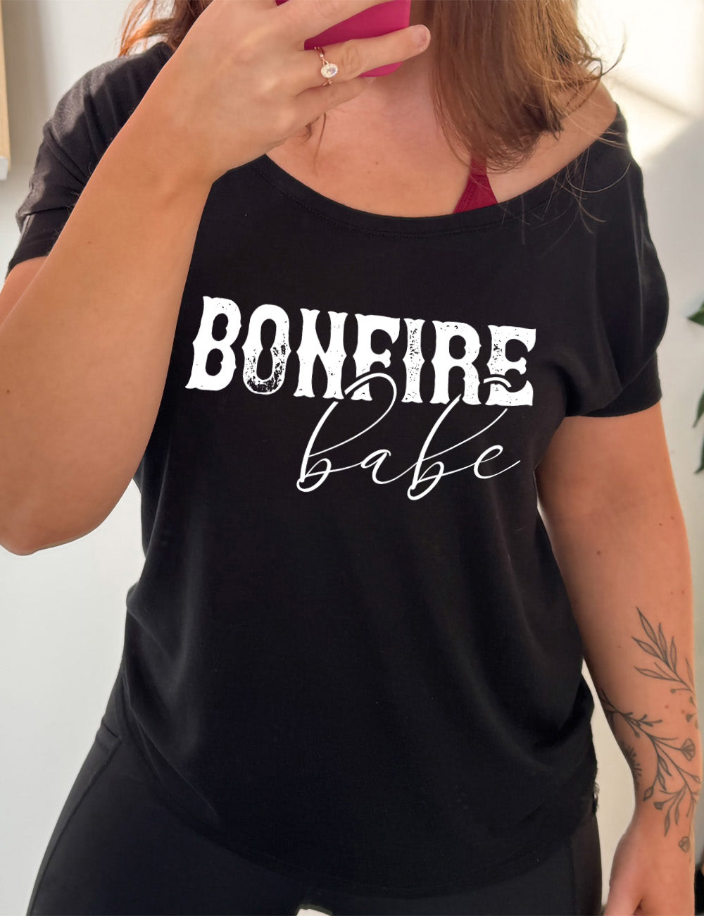 black slouchy tee with the words "bonfire babe" on it