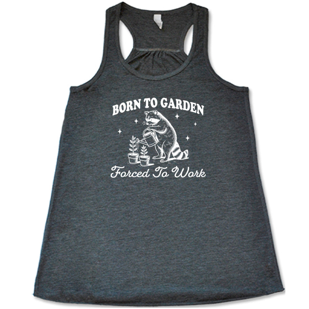 Grey colored flowy tank with a gardening raccoon graphic on it that says "Born to Garden, Forced to Work" 