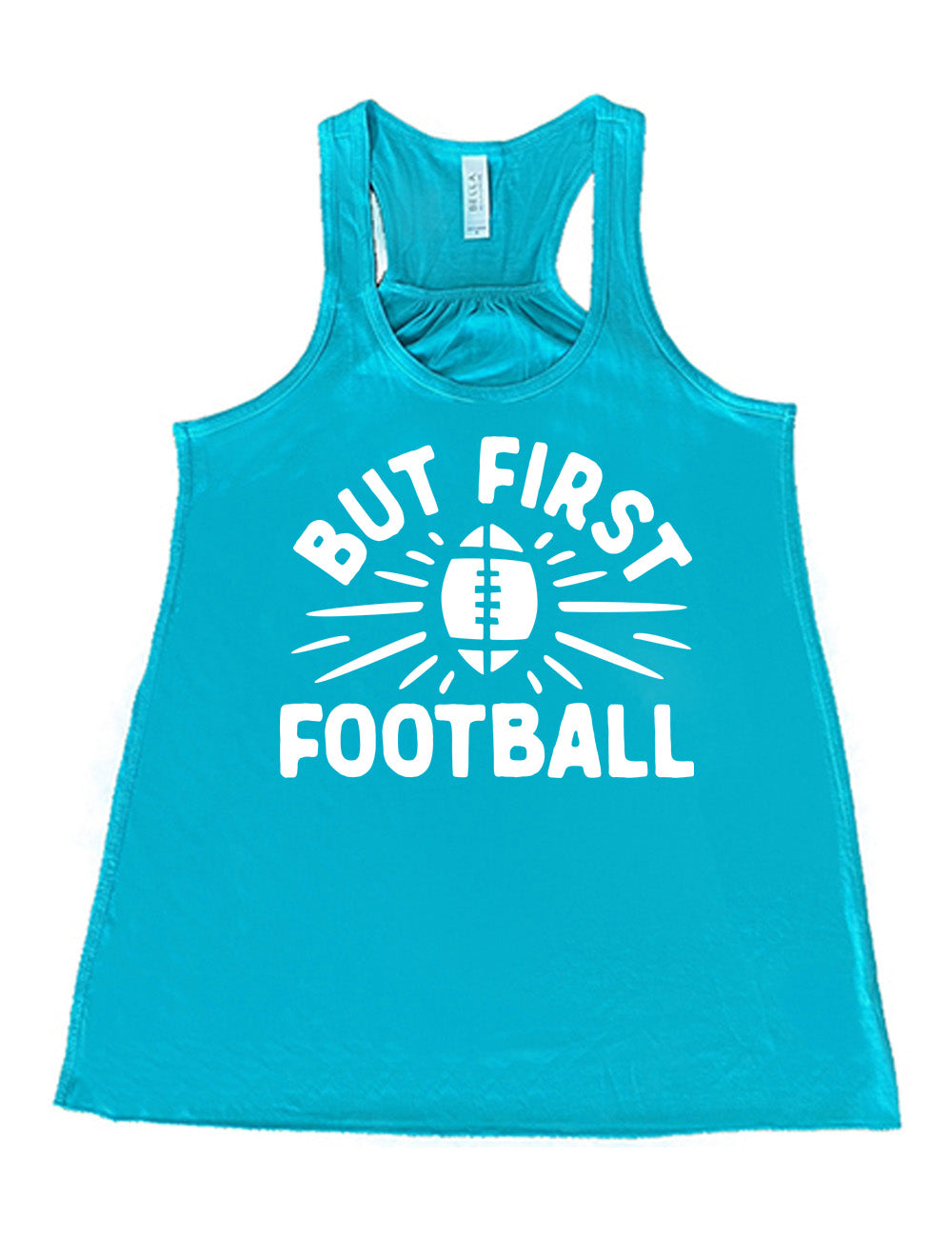 teal flowy racerback tank with the words "but first football" in capital font, with "But first" arching over the graphic of a football, with rays beaming off of it