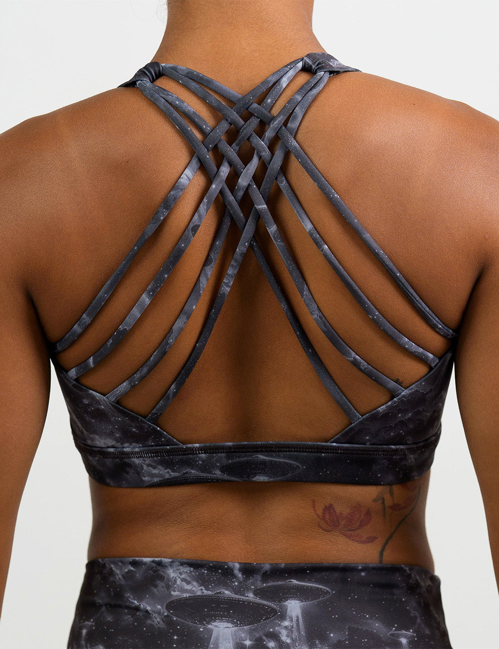 back of the alien space ship invasion sports bra against a white background