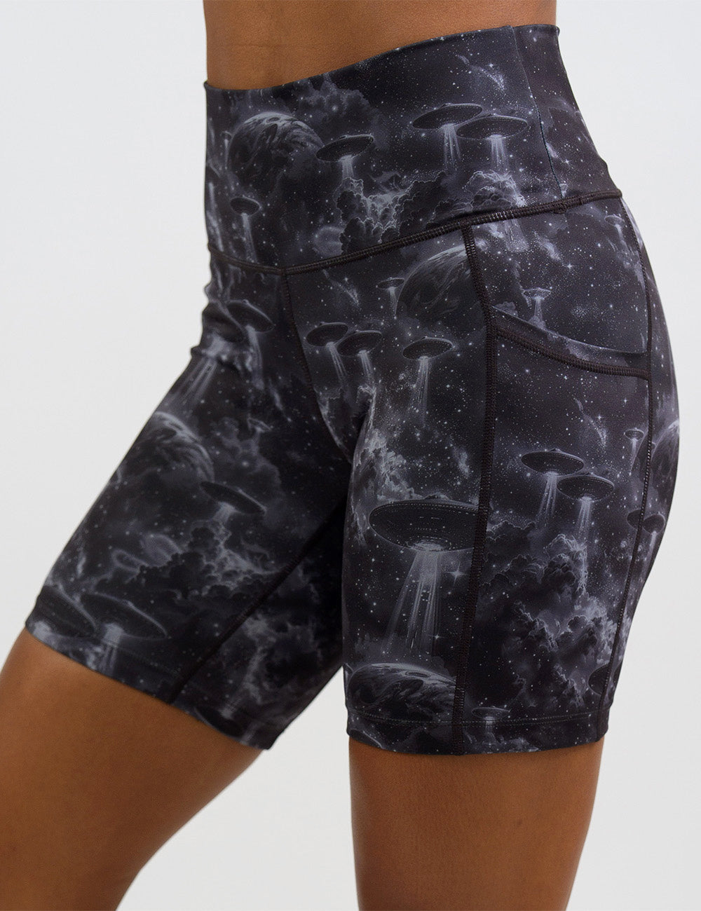 front of the alien space ship invasion 7 inch shorts against a white background