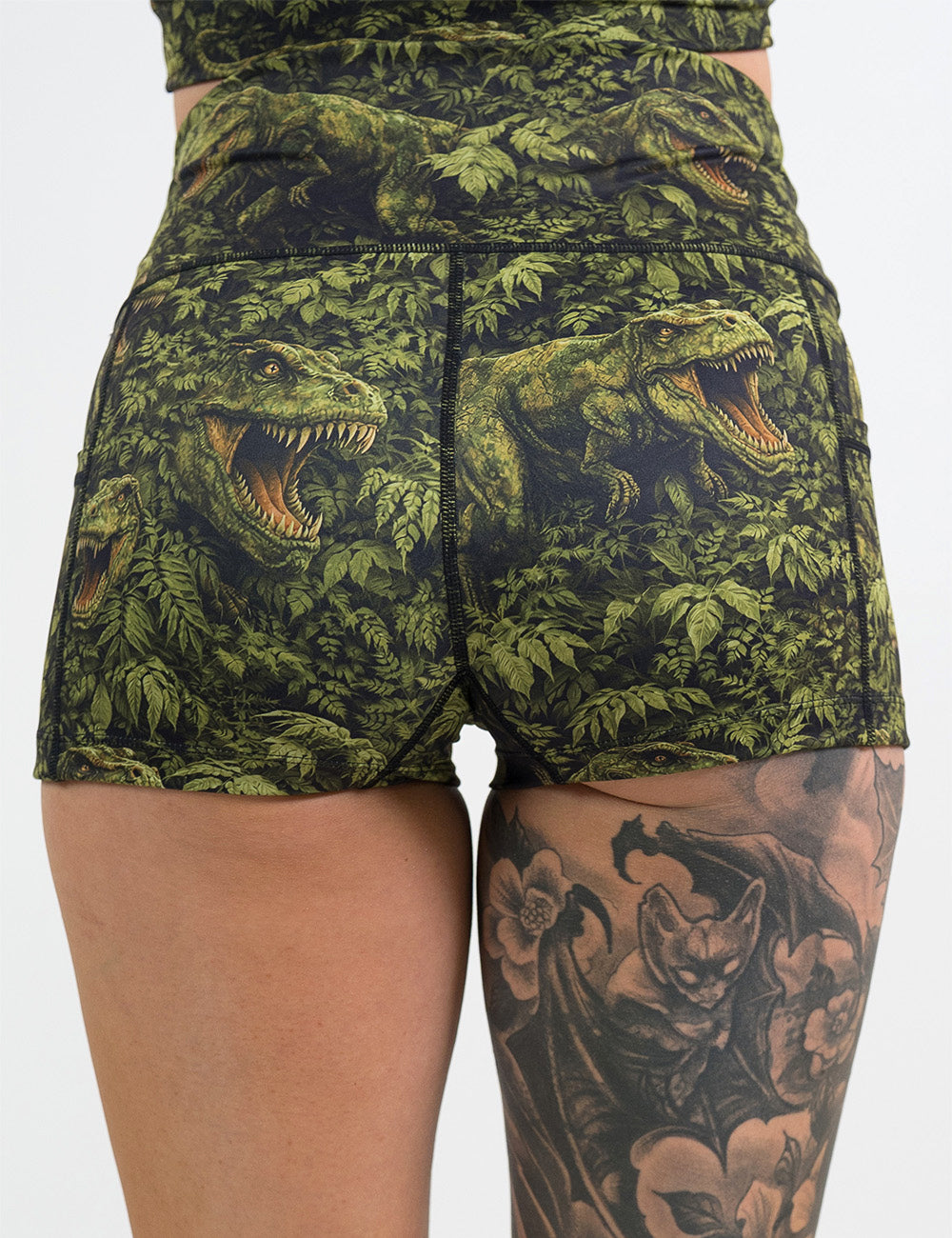 back of the 2.5 inch t-rex in a rainforest shorts against a white background
