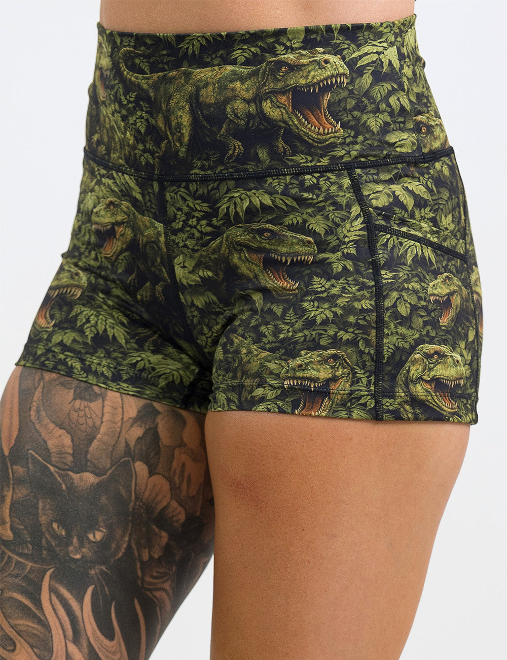 front of the 2.5 inch t-rex in a rainforest shorts against a white background