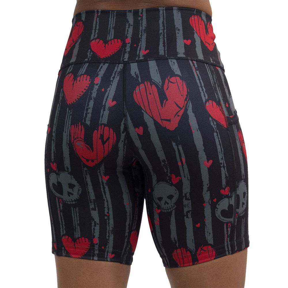 back of the red heart and gray skulls against a black and grey striped background 7 inch shorts against a white background