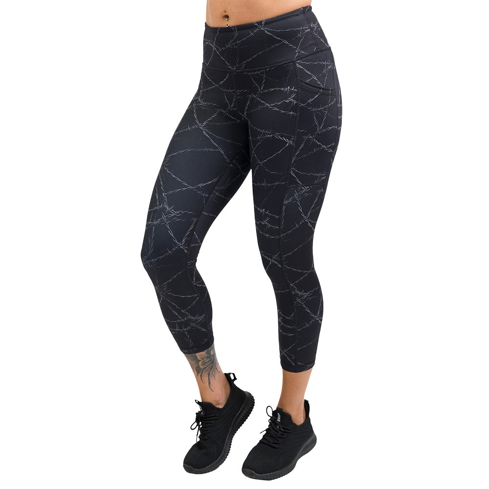 black leggings with a white barbed wire pattern on it