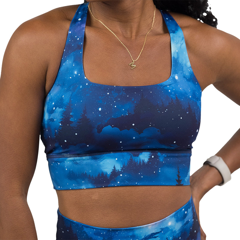 blue sky and forest patterned sports bra
