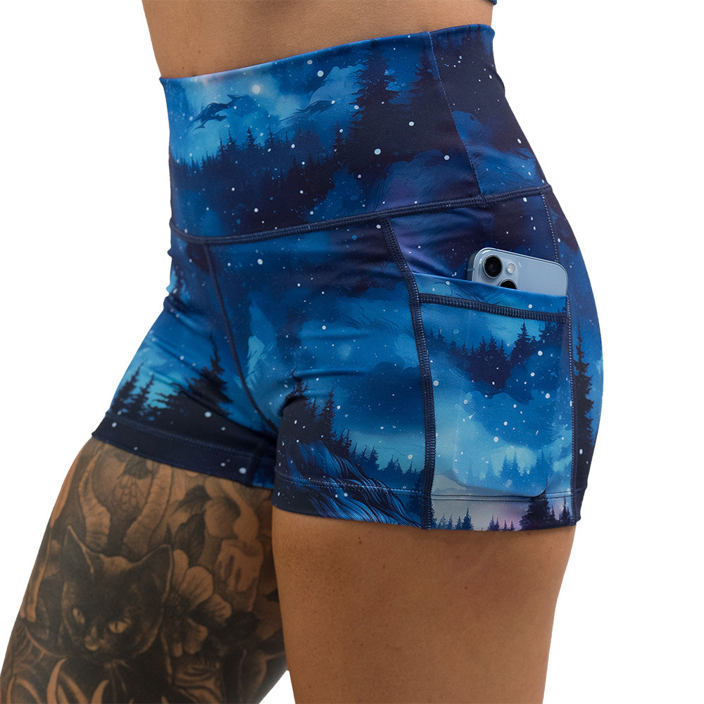 blue sky and forest patterned shorts
