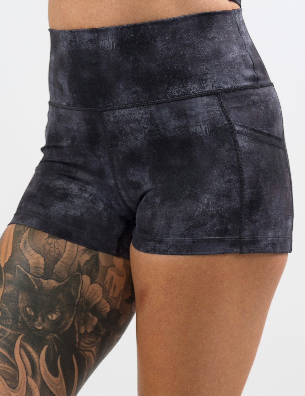 front of the black and grey grunge concrete pattern 2.5 inch shorts against a white background
