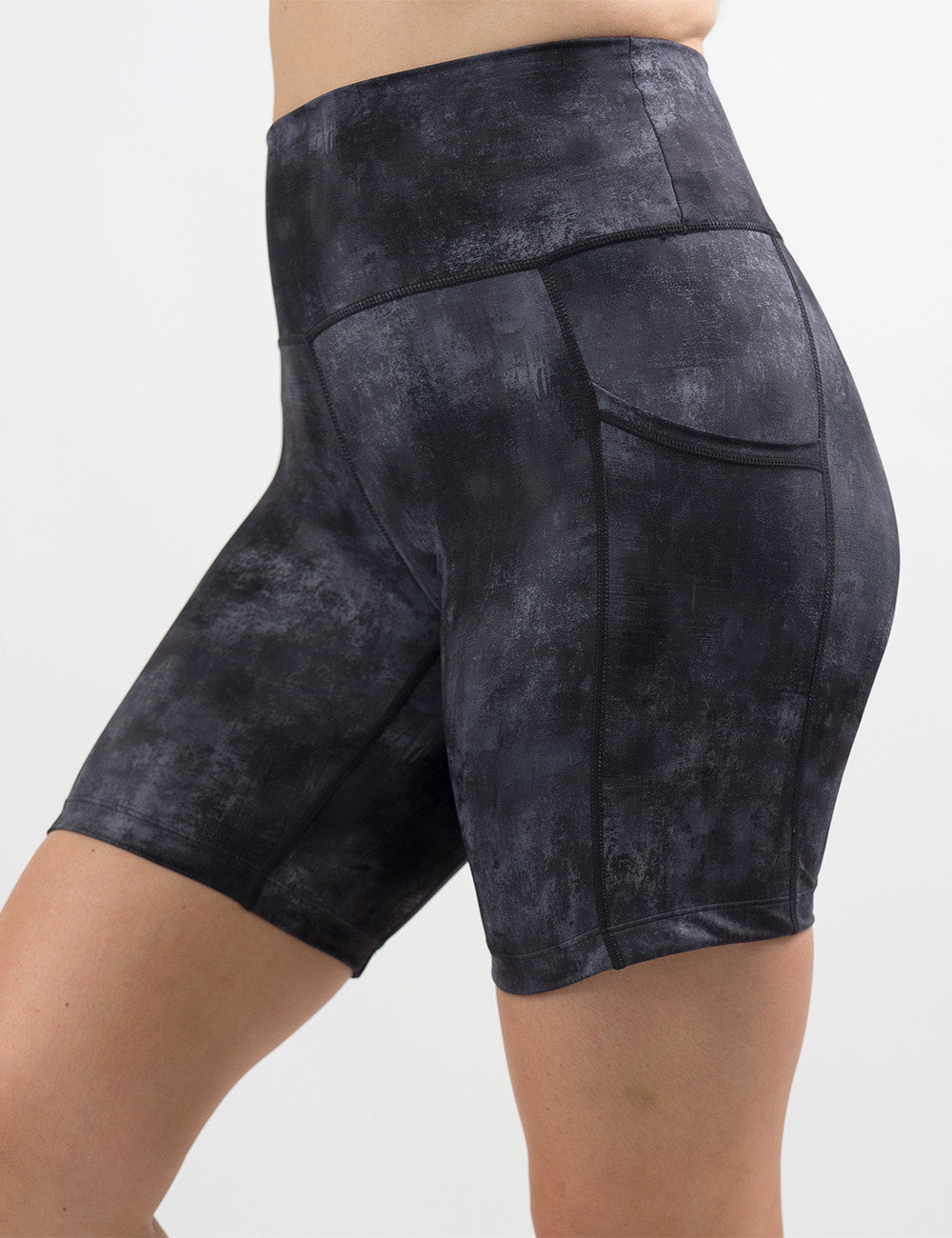 front of the black and grey grunge concrete pattern 7 inch shorts against a white background