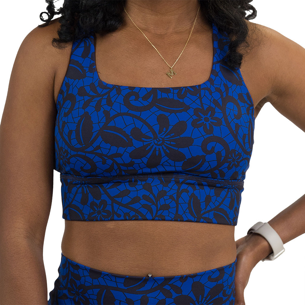 front of the black floral against a dark blue background against a white background