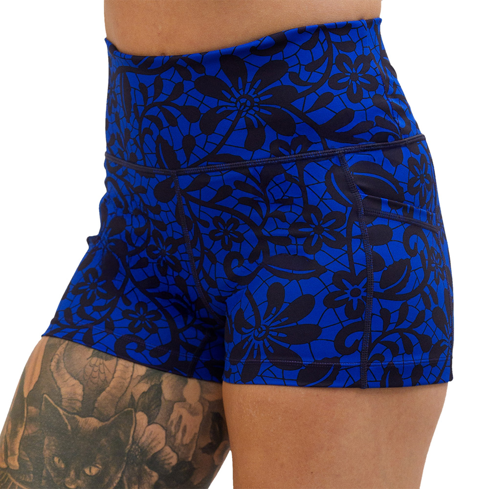 close up of the black floral against a dark blue background 2.5 inch shorts against a white background