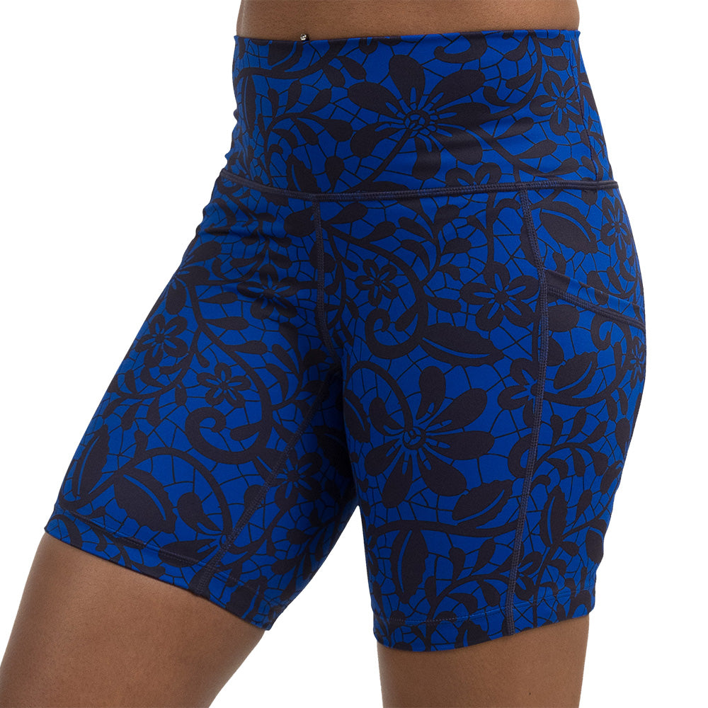 black floral against a dark blue background 7 inch shorts facing the front against a white background