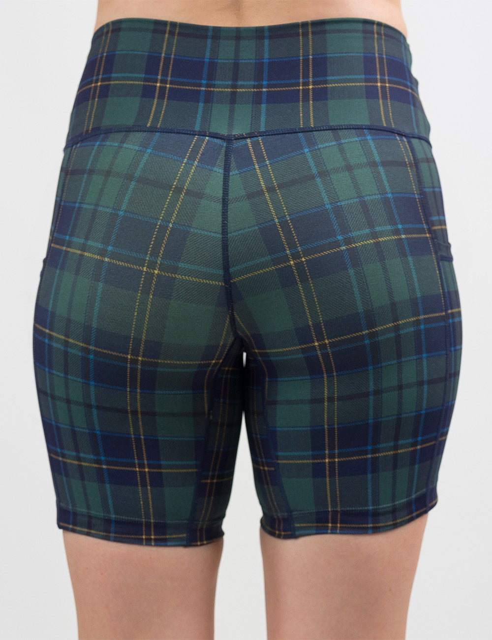back of the 7 inch blue, green, and yellow plaid shorts against a white background