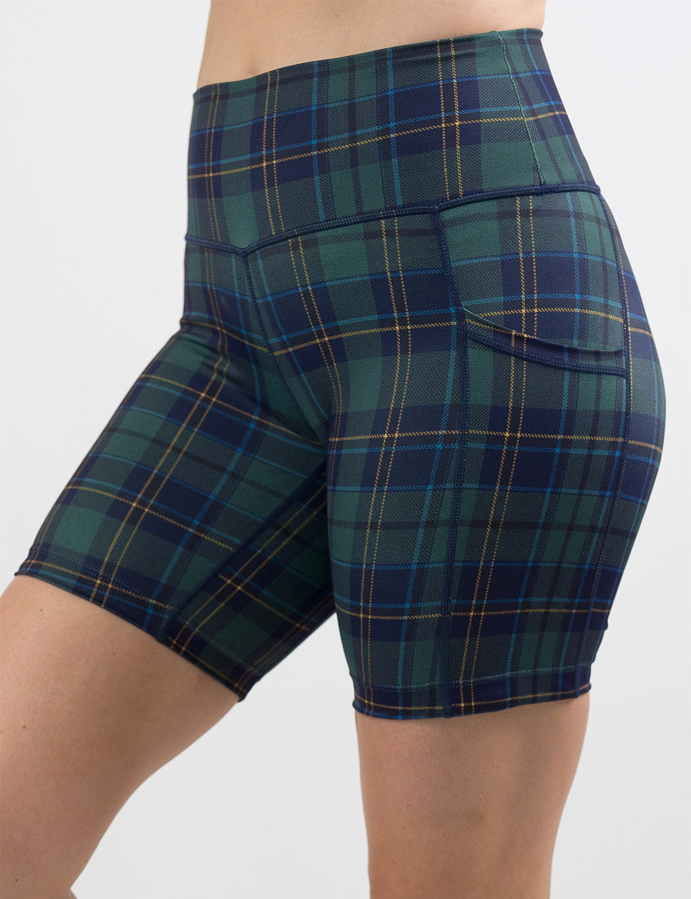 front of the 7 inch blue, green, and yellow plaid shorts against a white background