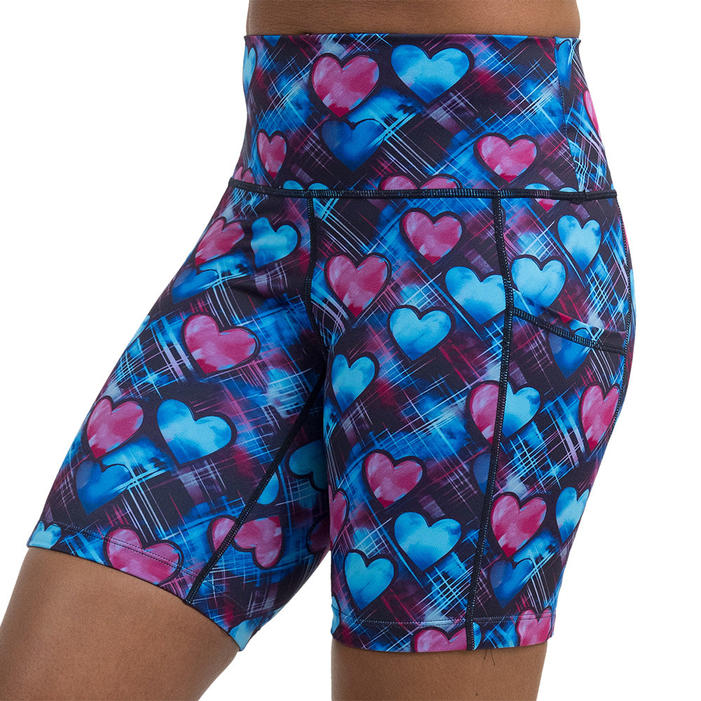 blue and pink hearts pattern against a dark stitched background 7 inch short  facing the front against a white background