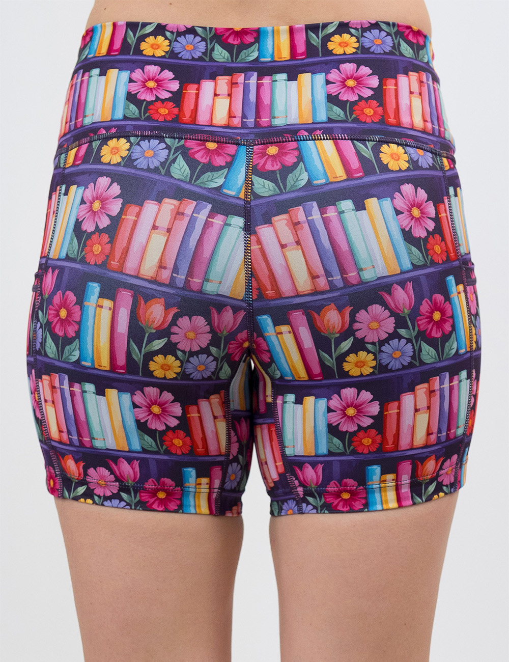 back of the 5 inch brightly colored books and flowers shorts against a white background