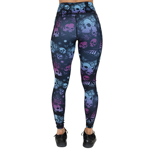 back of full length purple and blue skull and butterfly leggings