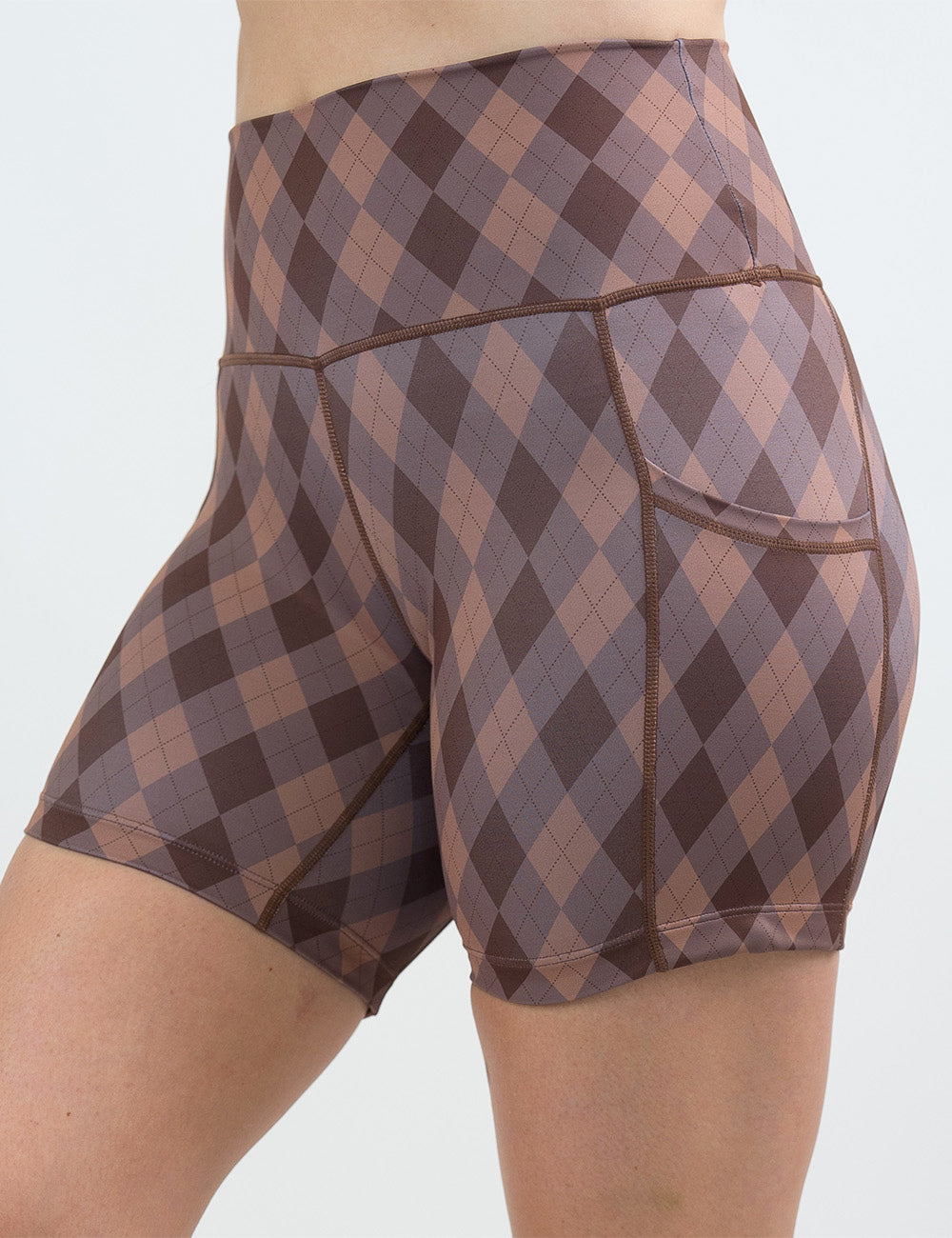 front of the 5 inch beige, grey, and brown plaid against a white background
