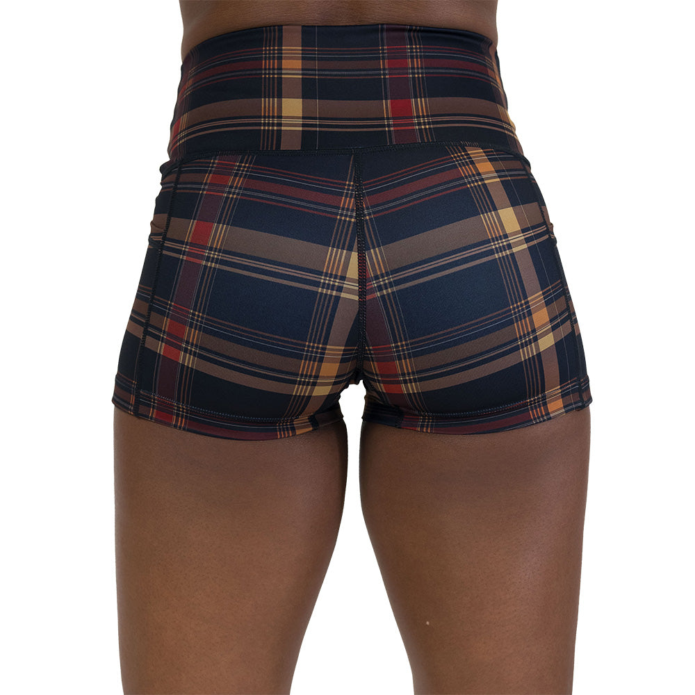 back of the brown, yellow & red plaid patterned shorts