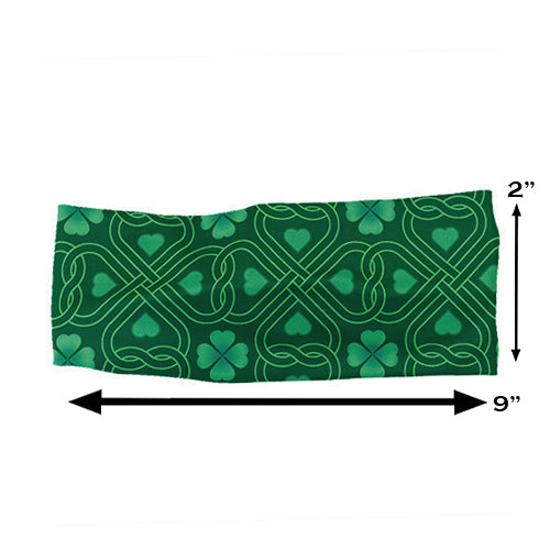 green celtic knots patterned headband measured at 2 by 9 inches