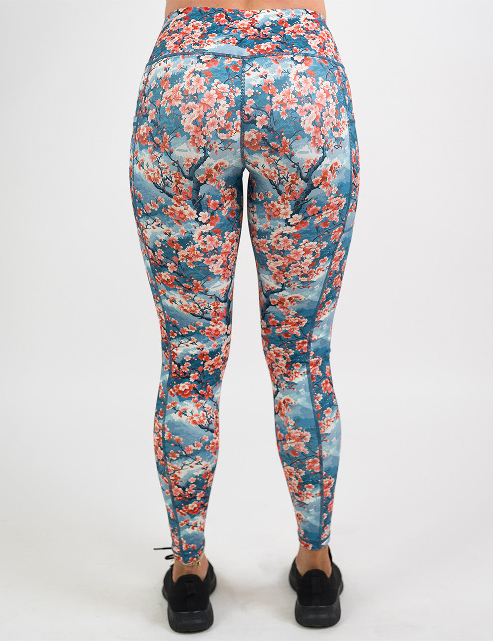 back of the full length cherry blossom tree leggings against a white background