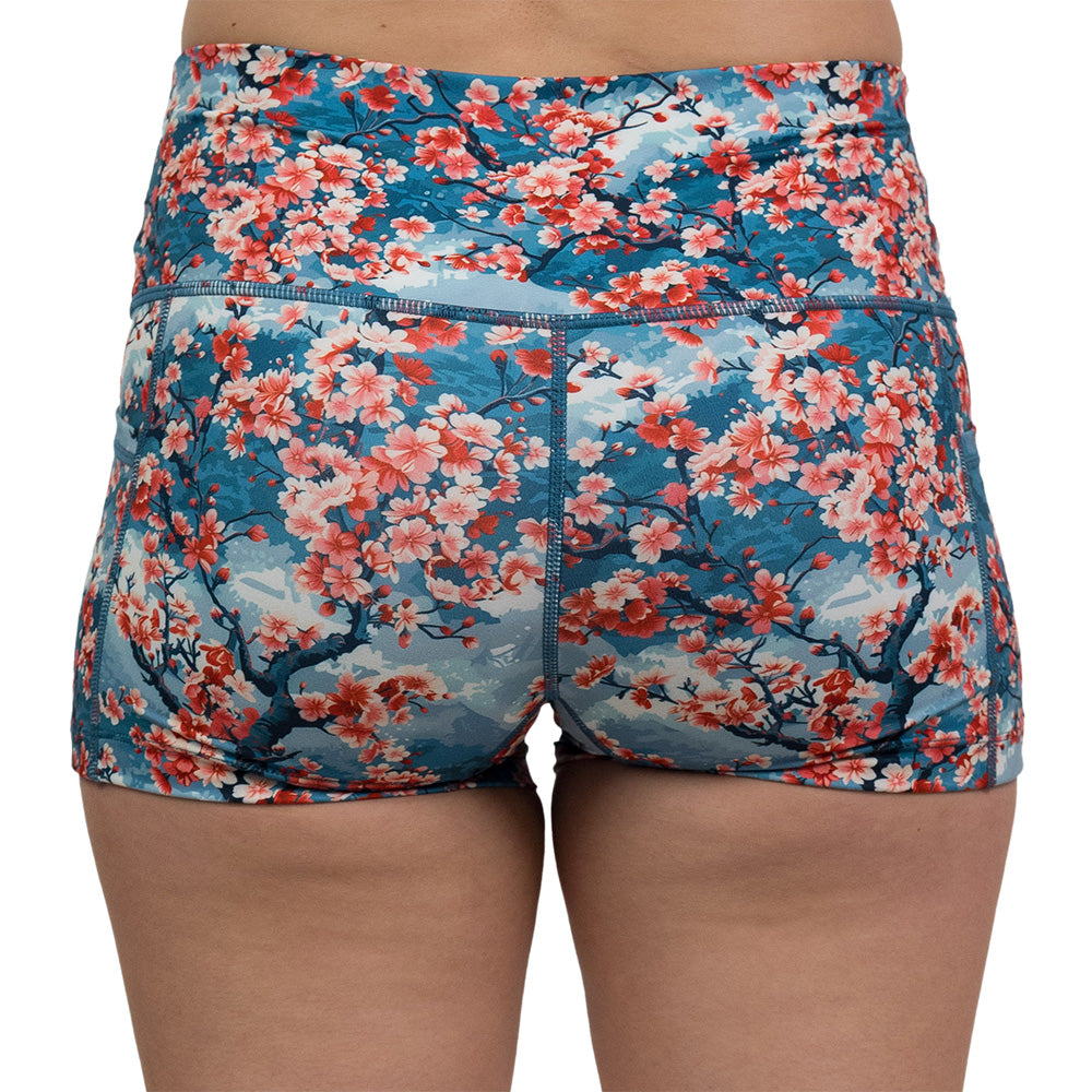 back of 2.5 inch blooming cherry tree print shorts against a white background