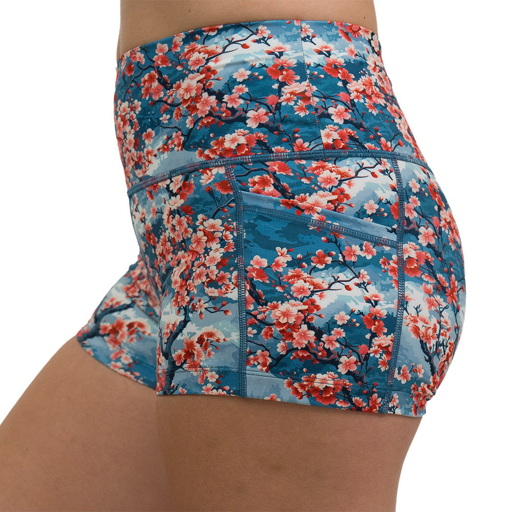 blooming cherry tree print 2.5 inch shorts facing the side against a white background