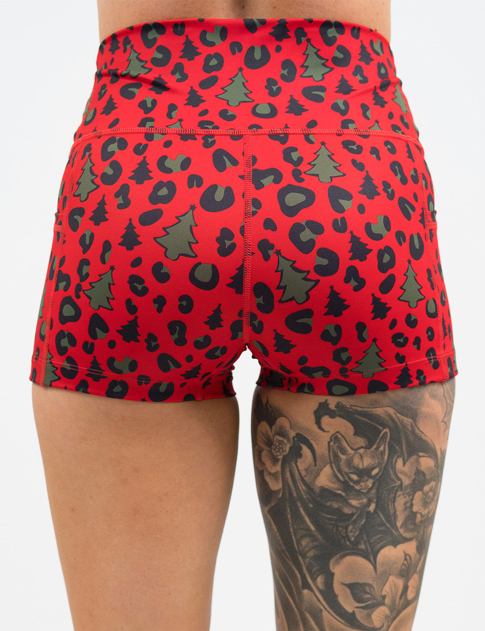 back of the red and brown Christmas trees and leopard print 2.5 inch shorts against a white background
