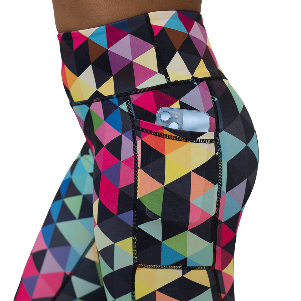 Colorful geometric-patterned leggings on a white background
