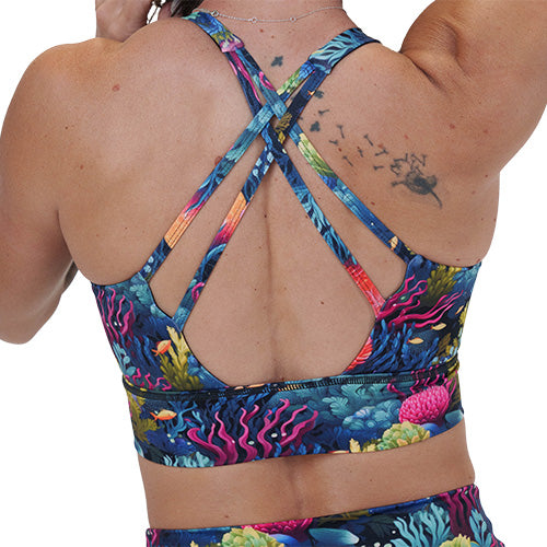 back of the coral reef patterned sports bra