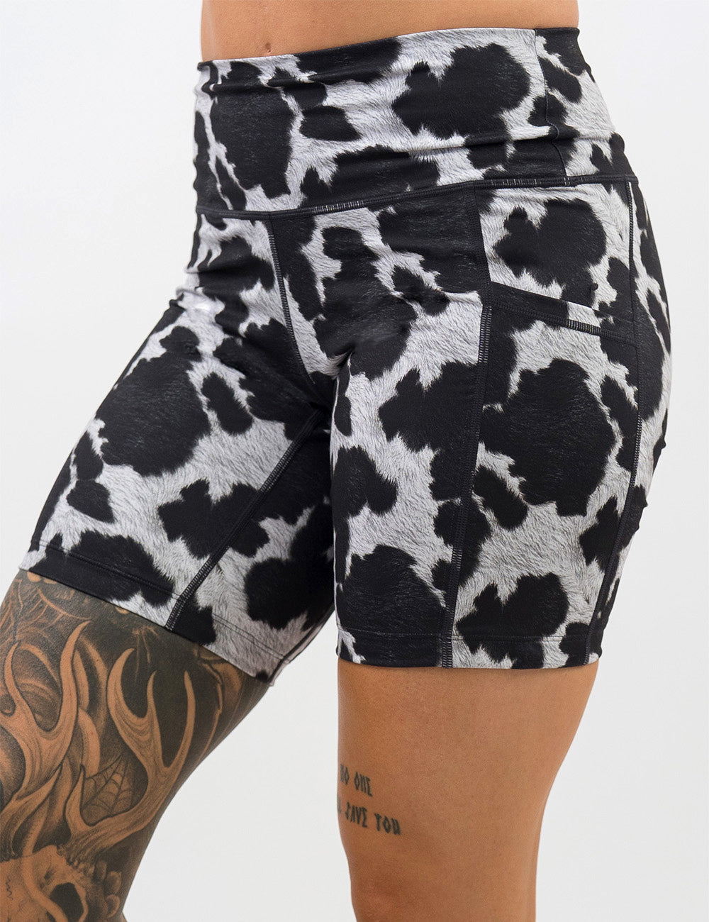 front of the 7 inch cow print shorts against a white background