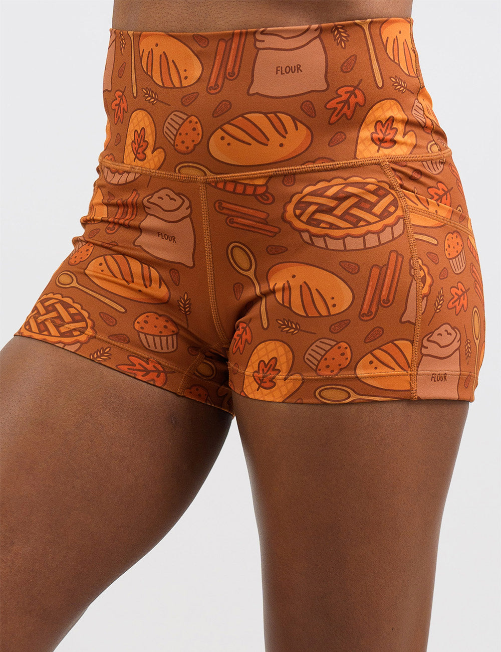 front of the orange baking themed 2.5 inch shorts against a white background