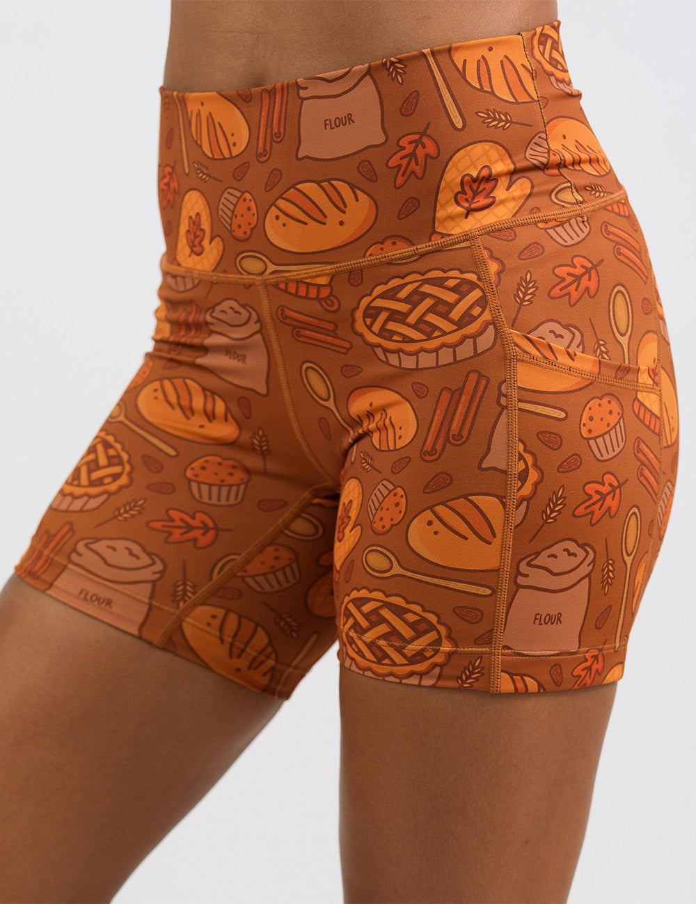 front of the 5 inch orange baking themed shorts against a white background
