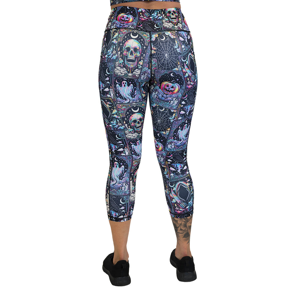 back of the Colorful Halloween-themed leggings with skulls, ghosts, and pumpkins