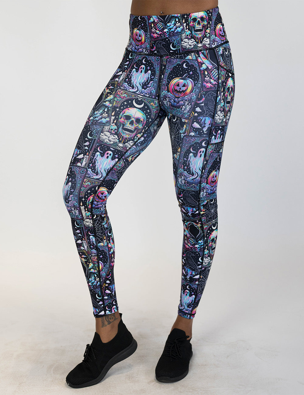 front of the rainbow skulls, jack o lantern, and ghosts full length leggings against a white background