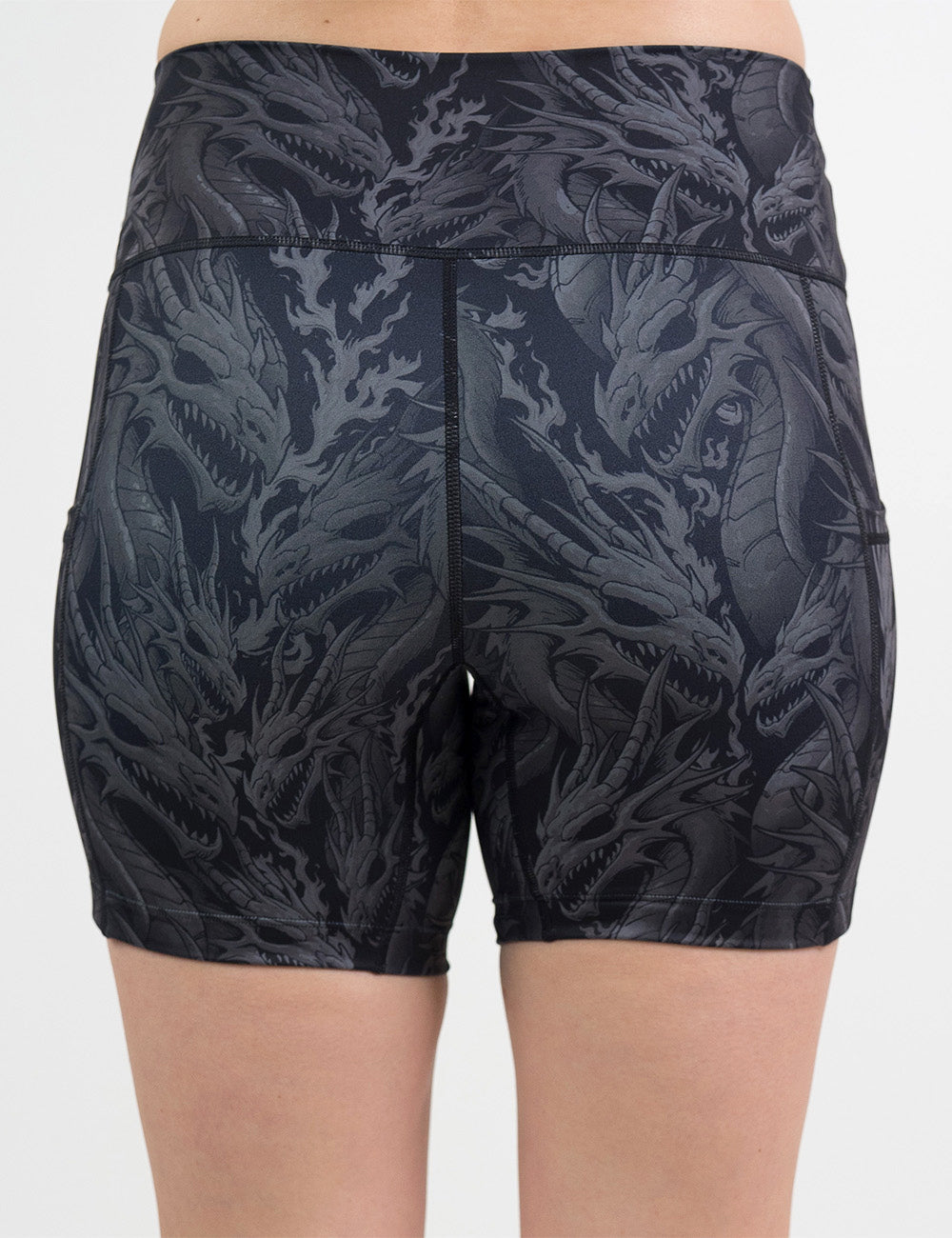 back of the 5 inch black shorts with a grey dragon pattern against a white background