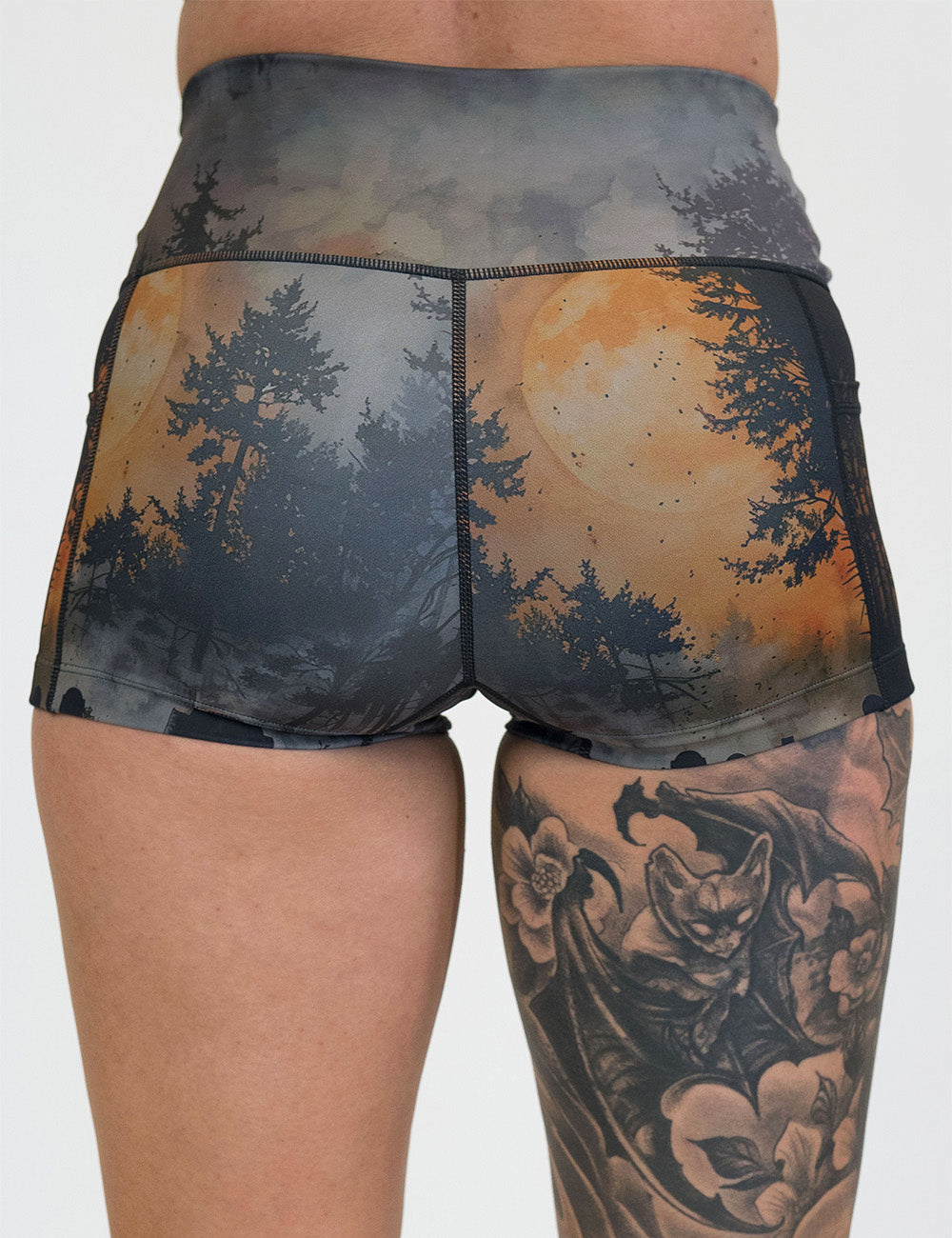 back of the dark cemetery with a full moon 2.5 inch shorts against a white background