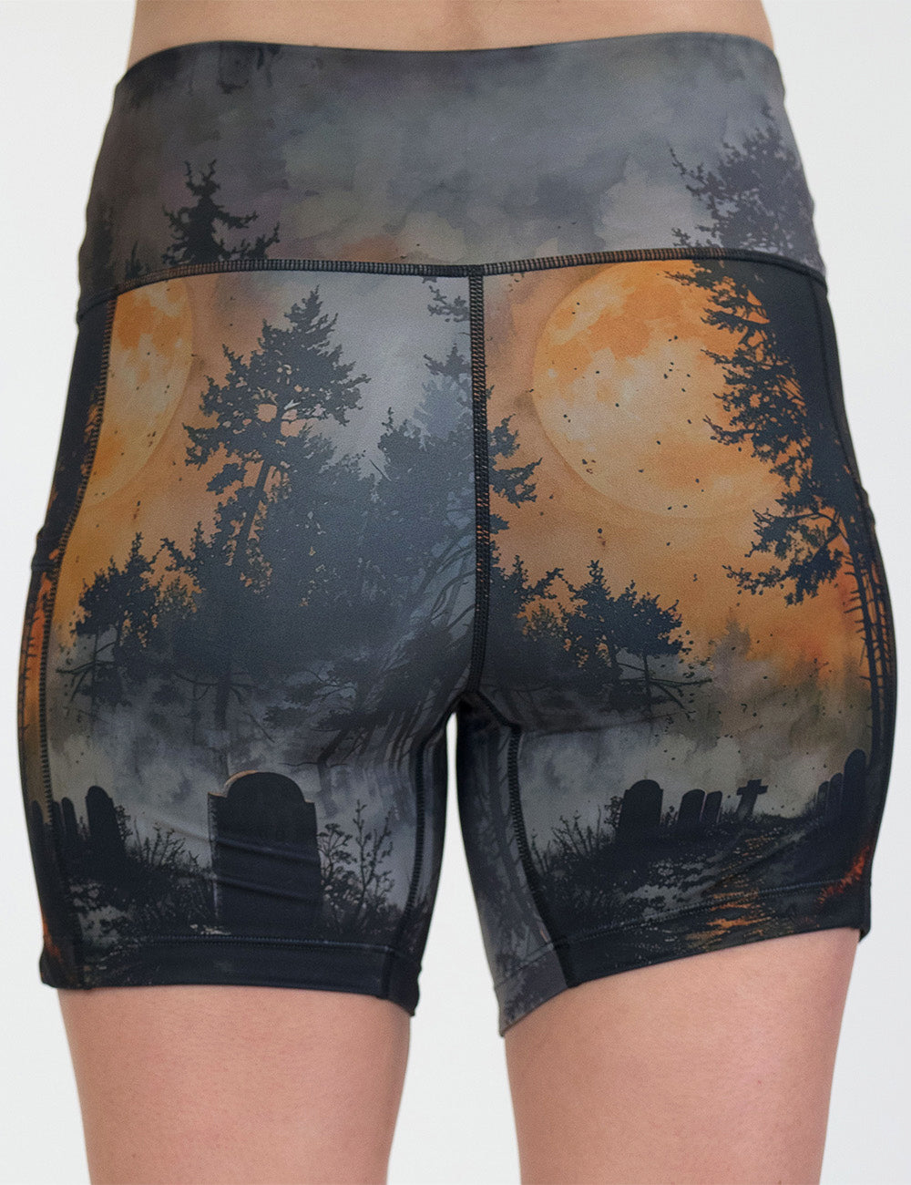 back of the dark cemetery with a full moon 5 inch shorts against a white background