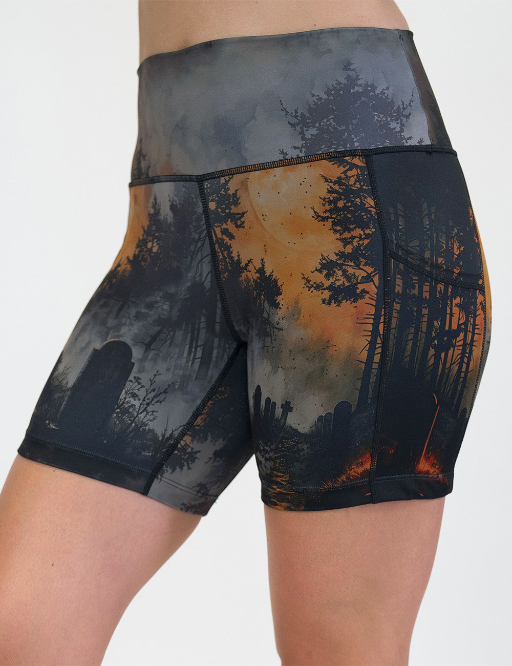 front of the dark cemetery with a full moon 5 inch shorts against a white background