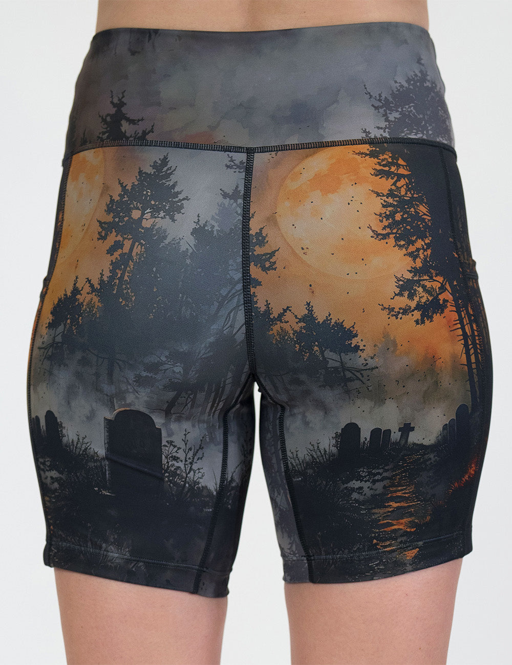 back of the dark cemetery with a full moon 7 inch shorts against a white background