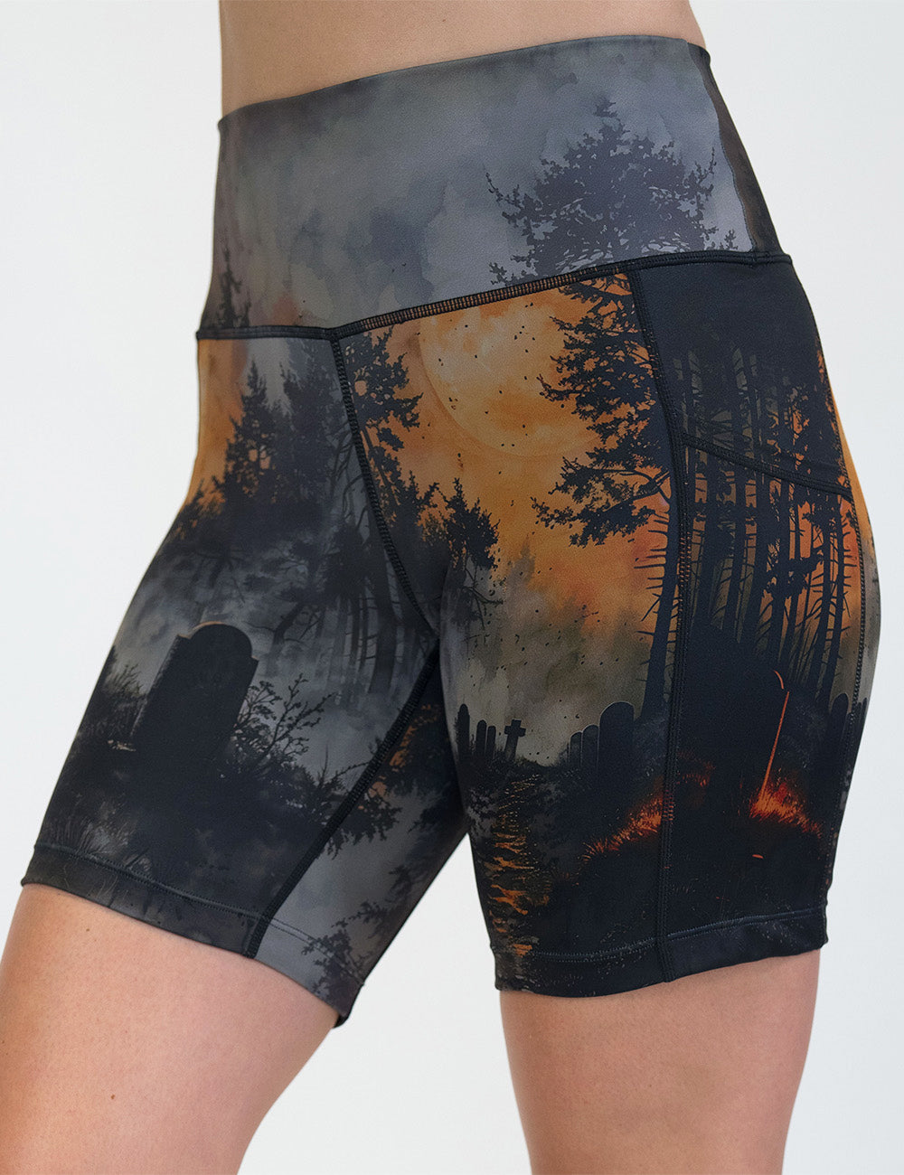 front of the dark cemetery with a full moon 7 inch shorts against a white background