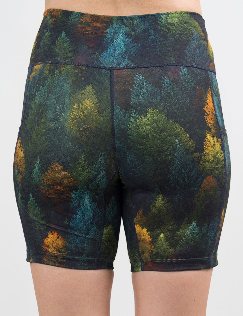 back of the 7 inch orange, green, and bluish green trees shorts against a white background