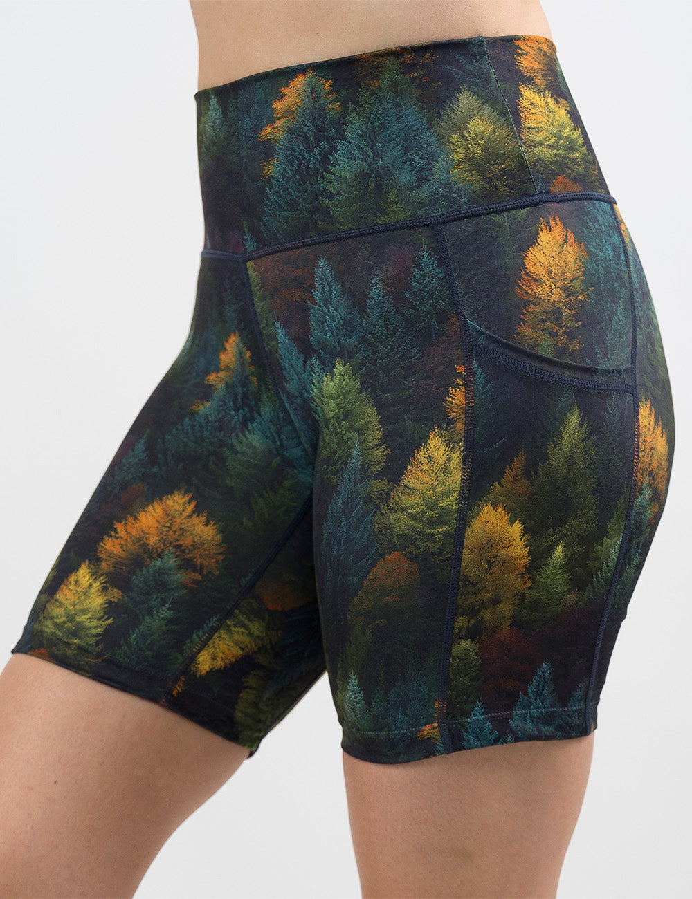 front of the 7 inch orange, green, and bluish green trees shorts against a white background