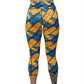 back of capri length blue and yellow dragon scale print leggings