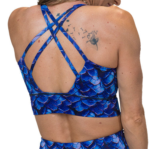 back of blue dragon scale print sports bra