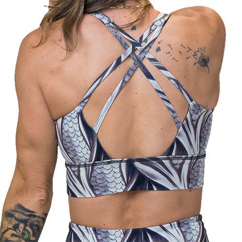 back of grey dragon scale print sports bra